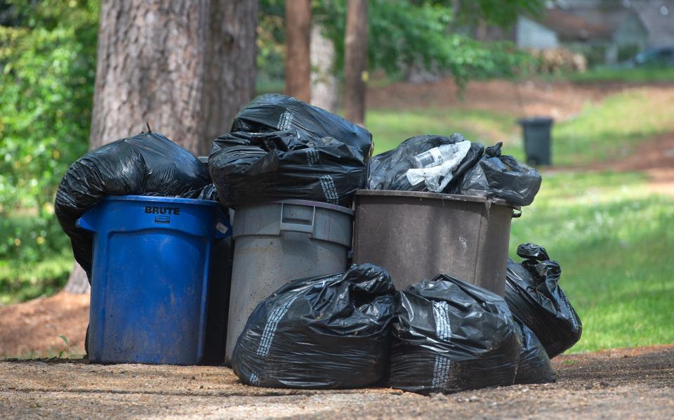 Optimistic Jackson, Miss., residents put out their trash in hopes of it being picked up Monday, April 3, 2023, although the mayor and city council have not come to an agreement on what company to award the contract to for trash pickup.