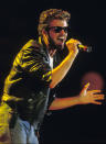 THEN: George Michael sings during Live Aid in Wembley stadium 13 July 2004. (Photo by Georges DeKeerle/Getty Images)