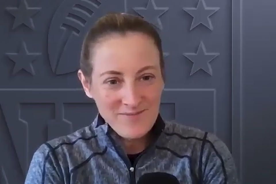 FILE - Sam Rapoport, NFL senior director of diversity, equity and inclusion, smiles during an interview over Zoom from New York on Nov. 10, 2022. Rapoport spearheaded the first NFL Women's Forum in 2017 with the goal of connecting female candidates to teams. It had aways bothered her that women couldn't pursue careers in a game they enjoyed. (AP Photo/File)