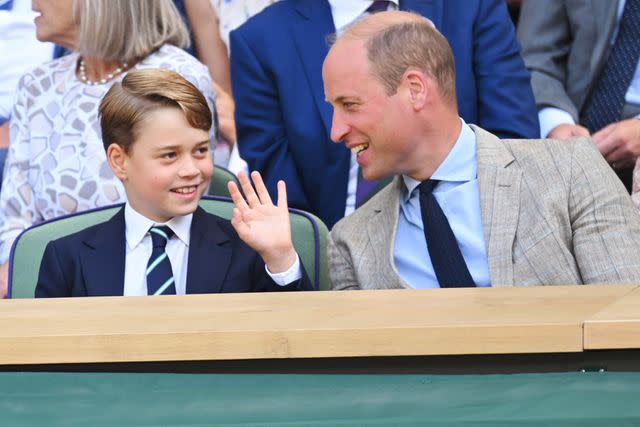 <p>Karwai Tang/WireImage</p> Prince George (left) and Prince William (right) at Wimbleton on July 10, 2022