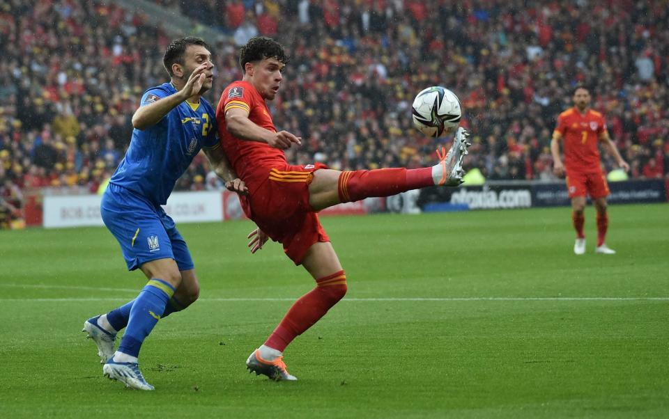 Ukraine's Oleksandr Karavaev, left, challenges for the ball with Wales Neco Williams during the World Cup 2022 qualifying play-off soccer match between Wales and Ukraine at Cardiff City Stadium, in Cardiff, Wales, Sunday, June 5, 2022 - AP