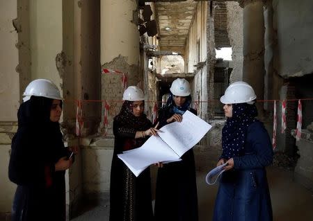 Afghan female engineers discuss inside the ruined Darul Aman palace in Kabul, Afghanistan October 2, 2016. REUTERS/Mohammad Ismail