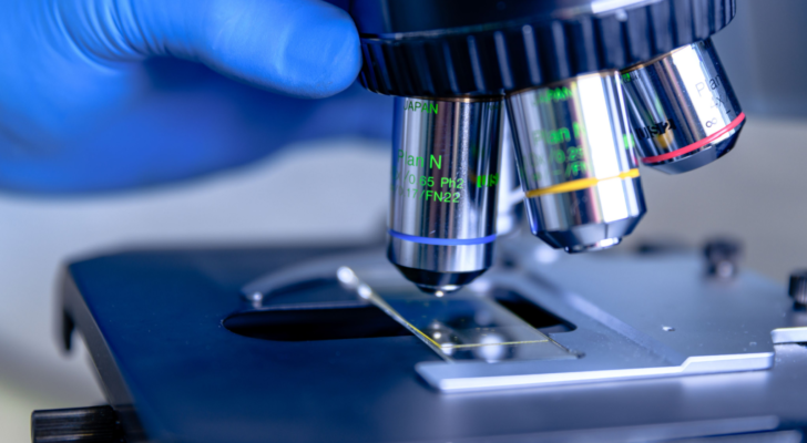 Scientific handling a light microscope examines a laboratory sample for pharmaceutical bioscience research. Concept of science, laboratory and study of diseases. Twist Biosciences (TWST)