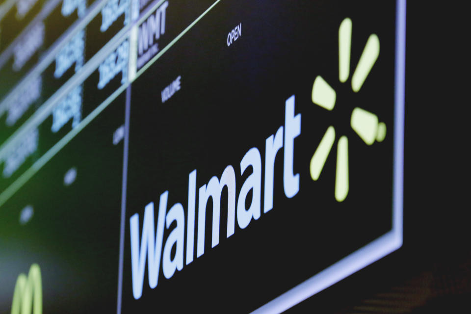 The logo for Walmart appears above a trading post on the floor of the New York Stock Exchange, Thursday, May 17, 2018. Walmart is set to report earnings before the market open (AP Photo/Richard Drew)