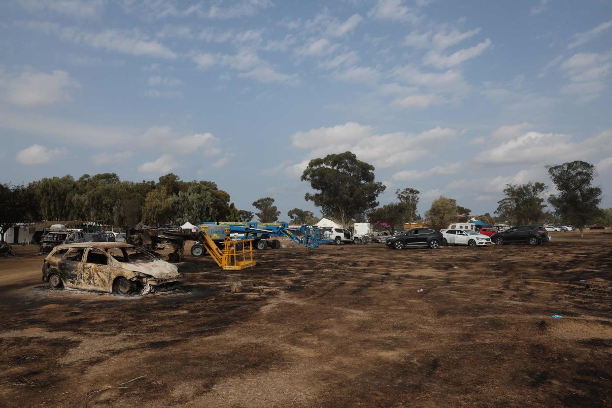 Cars are left behind at the site of the weekend attack on the Supernova desert music Festival by Palestinian militants (AFP via Getty Images)