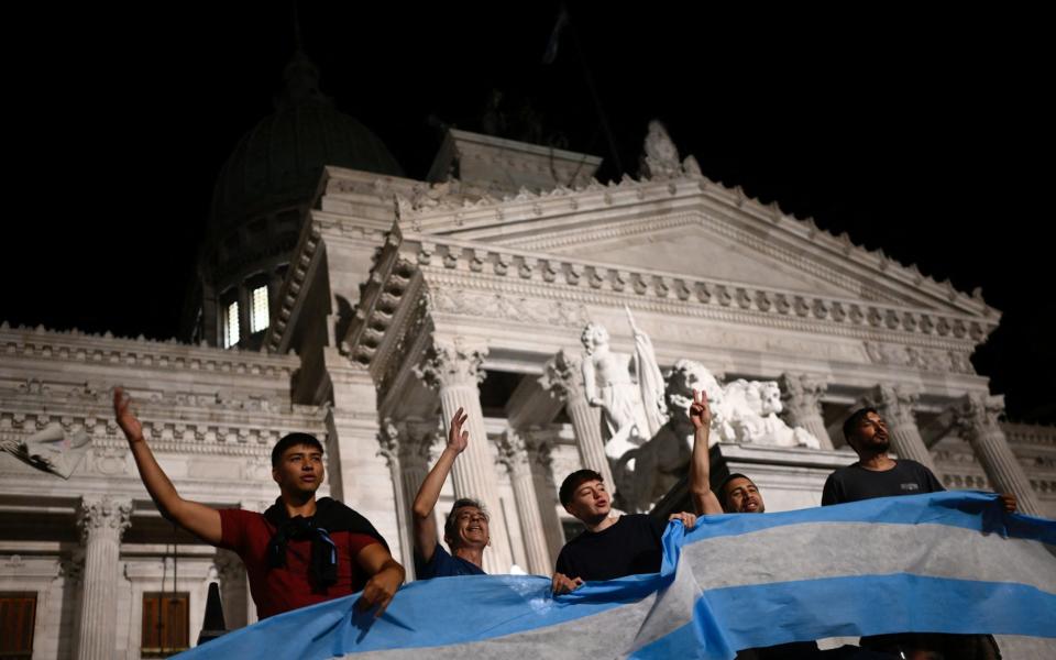 Protesters during a demonstration against the president’s new measures in front of the National Congress in Buenos Aires