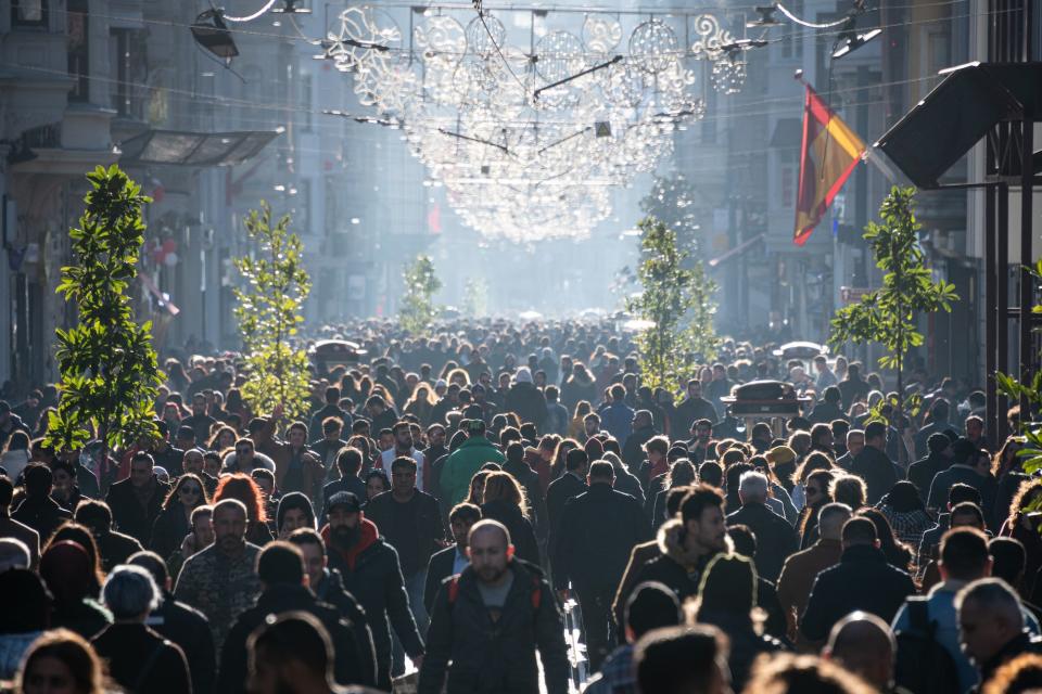 Crowds of pedestrians and tourists enjoy a sunny day on Istiklal street, a historic commercial and shopping area and public urban space of Istanbul on February 17.