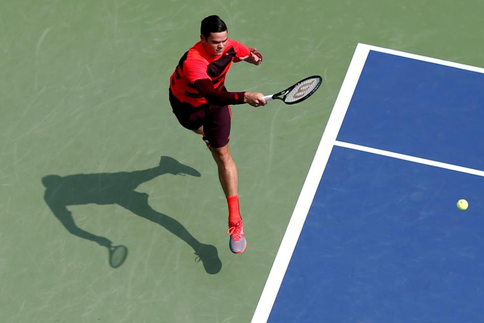 Milos Raonic of Canada hits a return to Fernando Verdasco of Spain during their match at the U.S. Open Championships tennis tournament in New York, September 2, 2015. REUTERS/Mike Segar