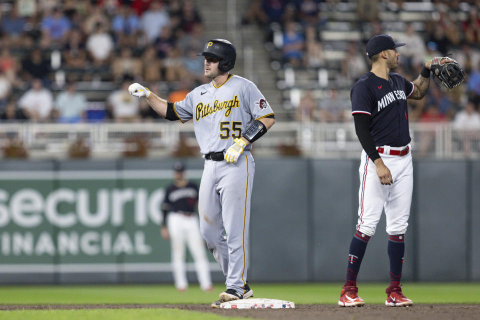 Pittsburgh Pirates' Jason Delay (55) celebrates after hitting a double against Minnesota Twins relief pitcher Jordan Balazovic in the ninth inning of a baseball game Saturday, Aug. 19, 2023, in Minneapolis. (AP Photo/Bailey Hillesheim)