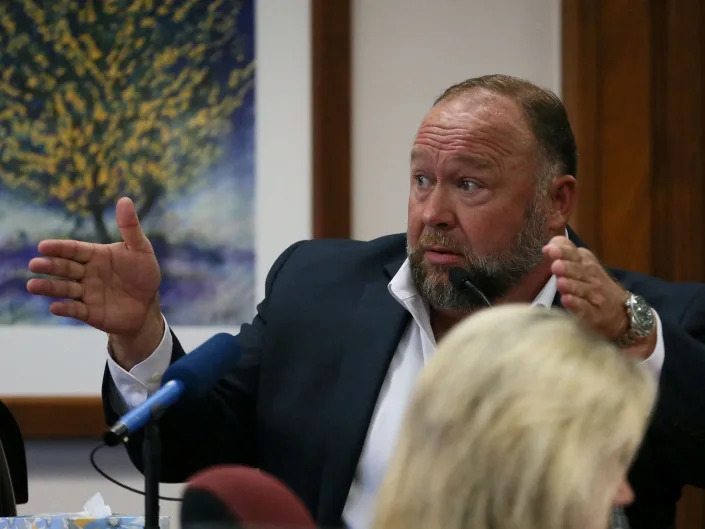 Alex Jones is called up to testify at the Travis County Courthouse during the his defamation trial, in Austin, U.S. August 2, 2022