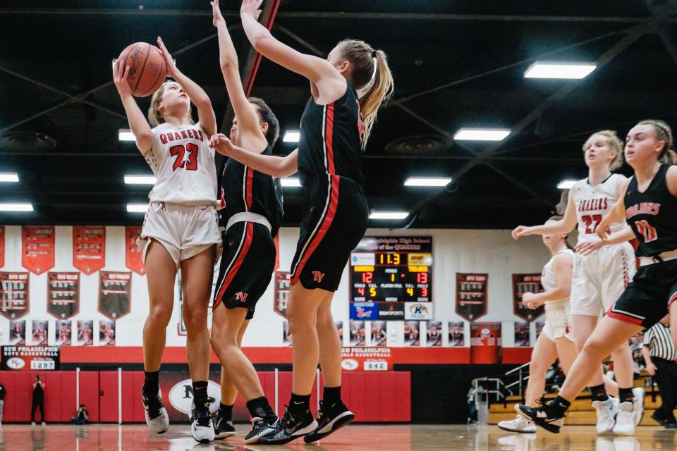 New Philadelphia's Carys Young looks to put up a shot as Tusky Valley puts on the pressure, Wednesday, Feb. 8.