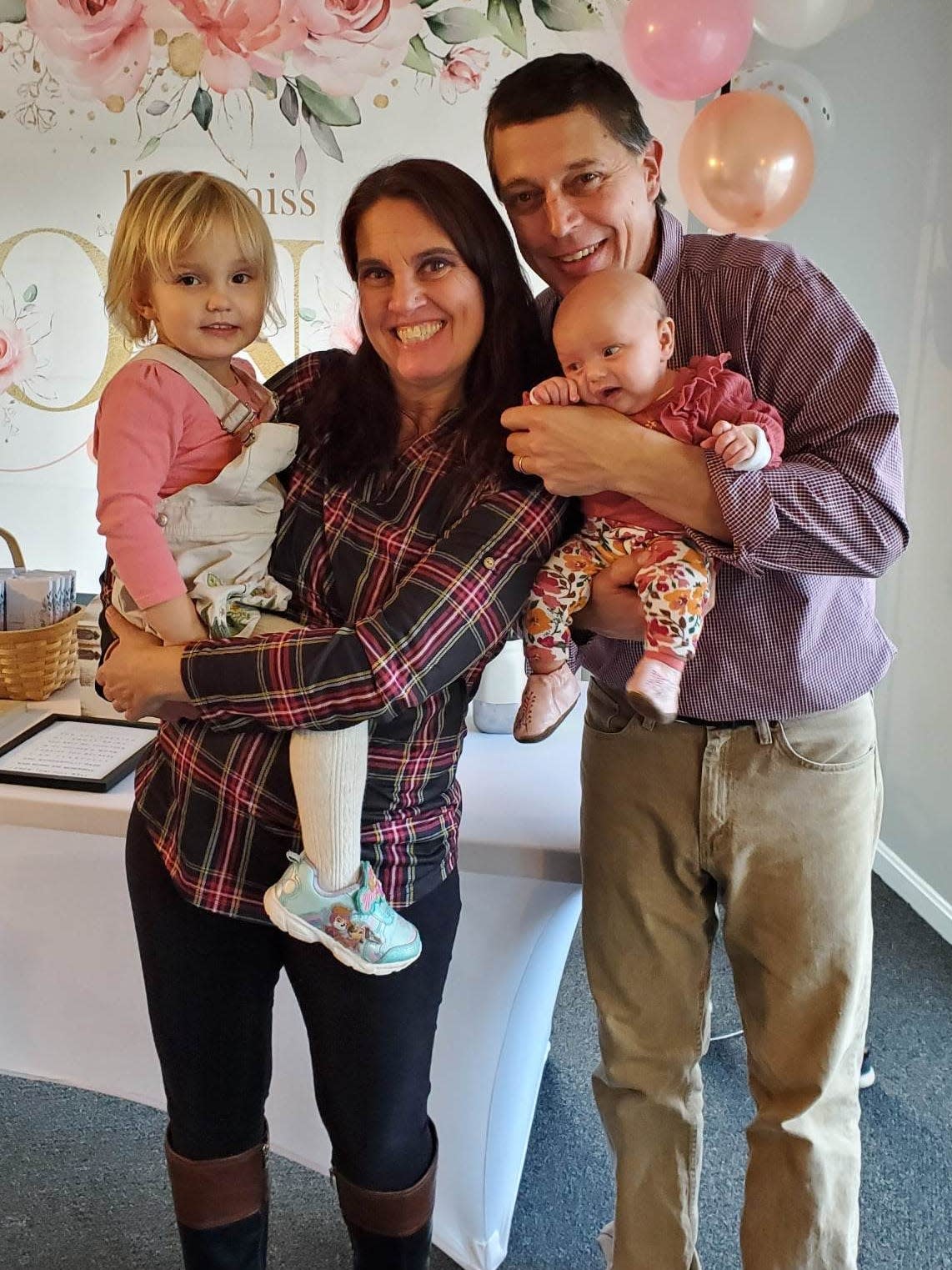 Jennifer Michalke and her family posing for a photo. 