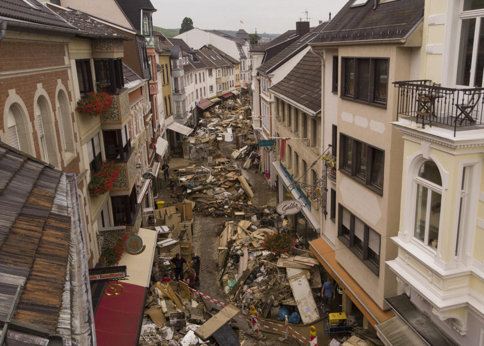 Rubbish cleaned by town residents lays in the streets of Bad Neuenahr-Ahrweiler, Germany, Monday July 19, 2021. More than 180 people died when heavy rainfall turned tiny streams into raging torrents across parts of western Germany and Belgium, and officials put the death toll in Ahrweiler county alone at 110. (AP Photo/Bram Janssen)