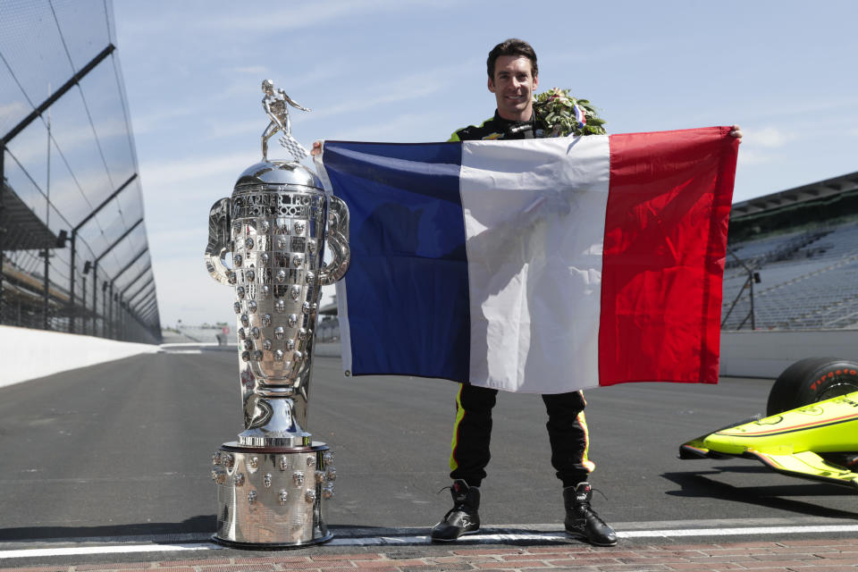 Simon Pagenaud, of France, winner of the 2019 Indianapolis 500 auto race, poses during the traditional winners photo session at the Indianapolis Motor Speedway in Indianapolis, Monday, May 27, 2019. (AP Photo/Michael Conroy)