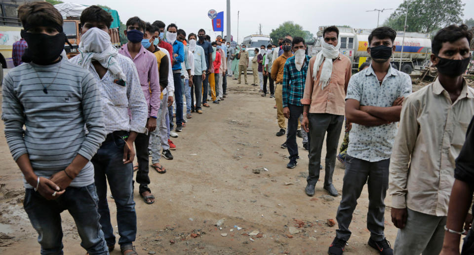 COVID-19 testing at a check post erected to screen people coming from outside the city in Ahmedabad, India. Source: AP