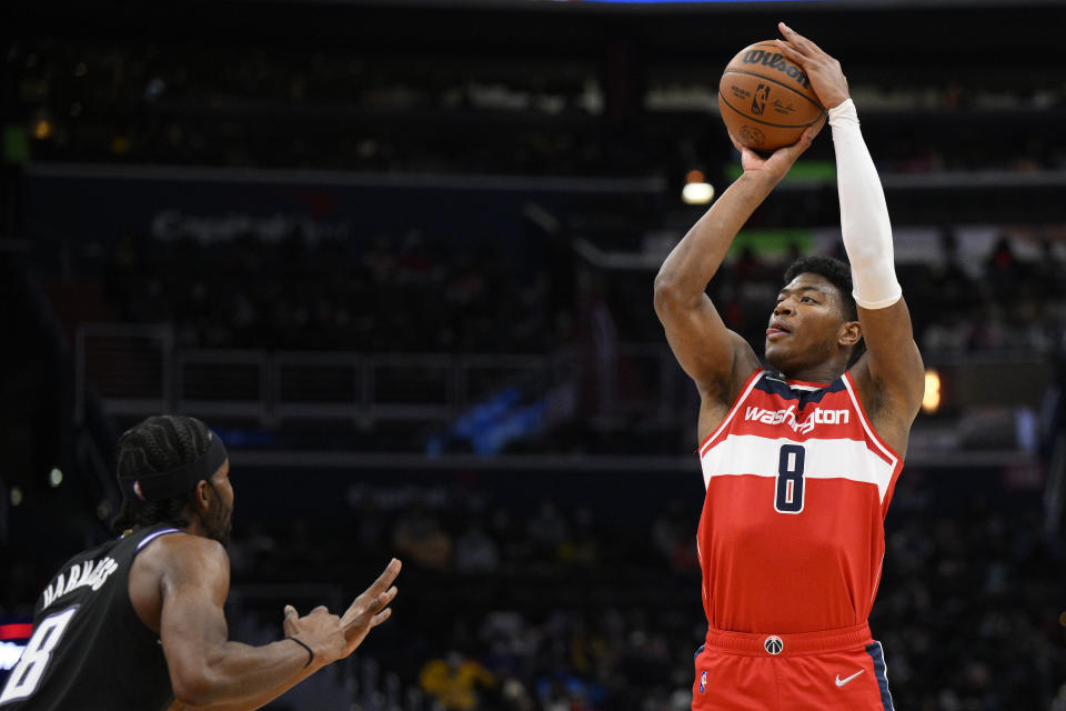 Washington Wizards forward Rui Hachimura (8) shoots against Sacramento Kings forward Maurice Harkless (8) during the first half of an NBA basketball game, Saturday, Feb. 12, 2022, in Washington. (AP Photo/Nick Wass)