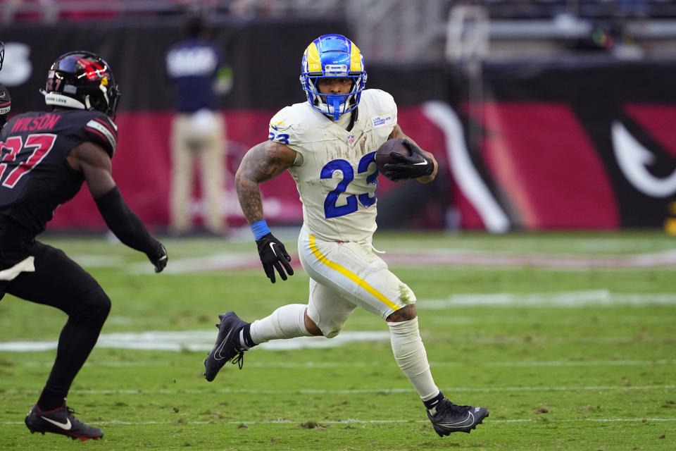 Los Angeles Rams running back Kyren Williams runs with the ball during the first half of an NFL football game against the Arizona Cardinals, Sunday, Nov. 26, 2023, in Glendale, Ariz. (AP Photo/Matt York)