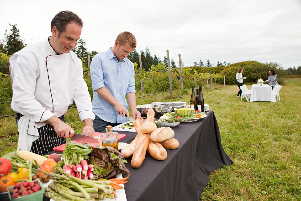 chefs prepping a meal outside