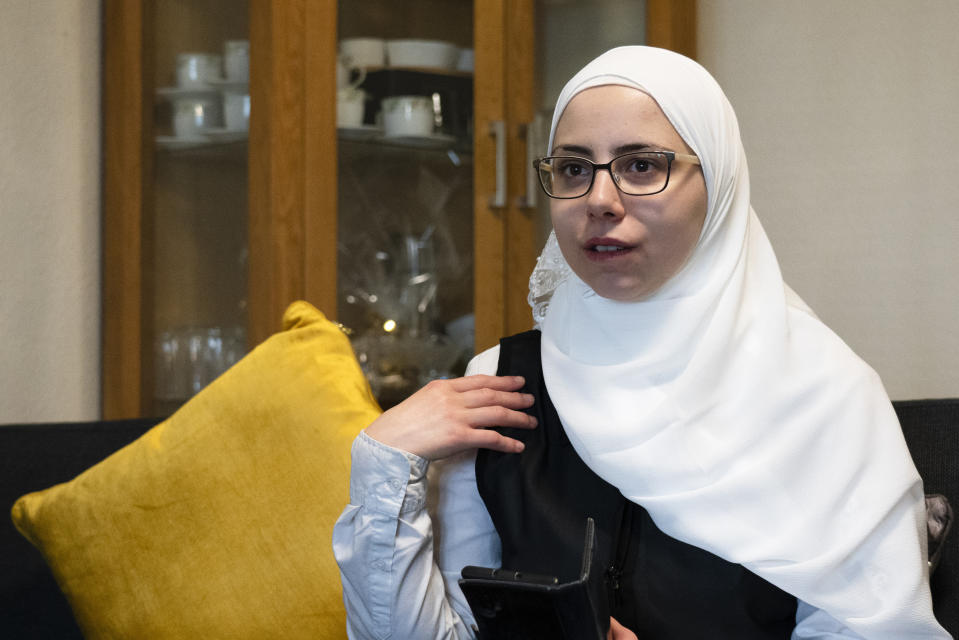 Faeza Satouf, a Syrian refugee who was granted asylum in Denmark in 2015, talks to The Associated Press during an interview in Nivaa, Denmark, Wednesday, April 21, 2021. Ten years after the start of the Syrian civil war, Denmark has become the first European country to start revoking the residency permits of some refugees from the Damascus area, including Satouf's. (AP Photo/David Keyton)