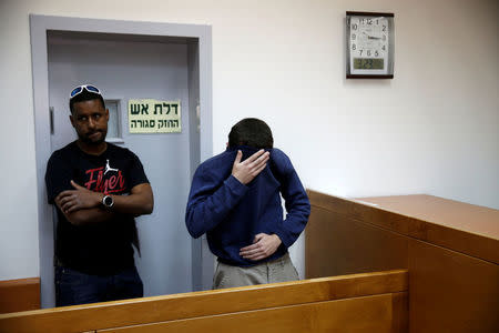 FILE PHOTO: A U.S.-Israeli teen arrested in Israel on suspicion of making bomb threats against Jewish community centres in the United States, Australia and New Zealand over the past three months, is seen before the start of a remand hearing at Magistrate's Court in Rishon Lezion, Israel March 23, 2017. REUTERS/Baz Ratner/File Photo