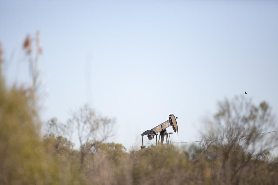 Old rusted oil rig in a field in Galveston, Texas. (Getty Images)