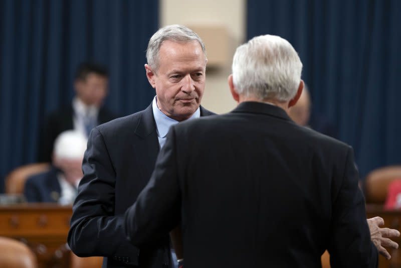 Social Security Administration Commissioner Martin O'Malley speaks with a representative before a House Ways and Means Subcommittee on Social Security hearing on Thursday. Photo by Bonnie Cash/UPI