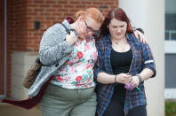 <p>A mother walks with her daughter, a student from Great Mills High School, as she picks her up from Leonardtown High School in Leonardtown, Md., Tuesday, March 20, 2018. (Photo: Carolyn Kaster/AP) </p>