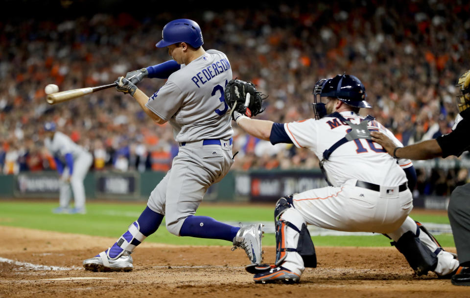 Joc Pederson hits a three-run home run against the Houston Astros during the ninth inning of Game 4 of the World Series. (AP)