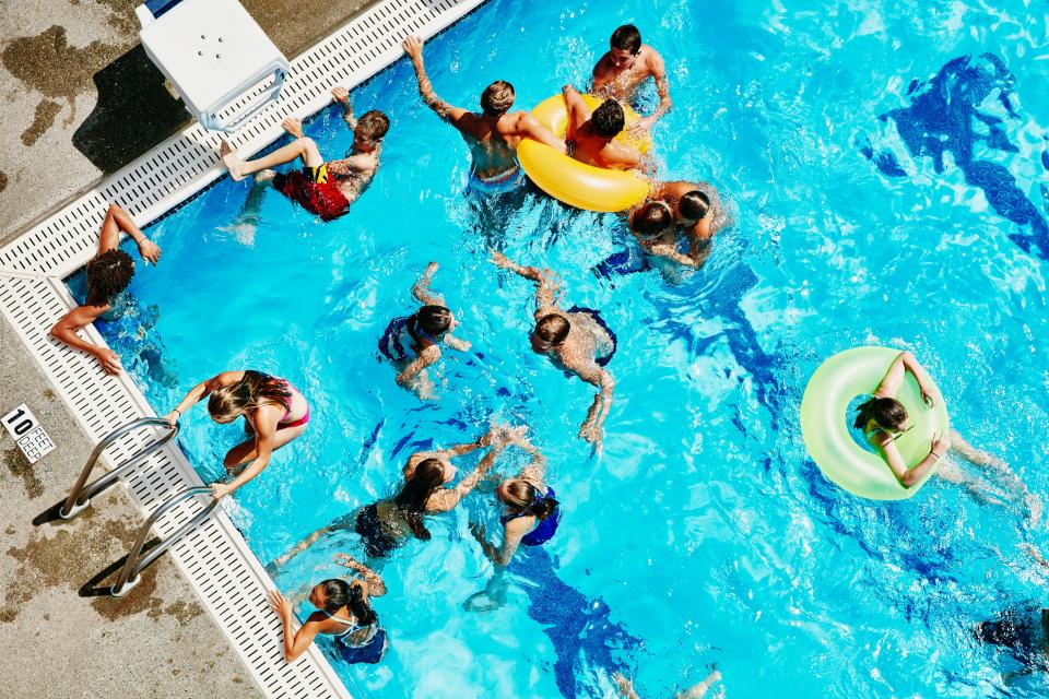 A group of people in a public pool.