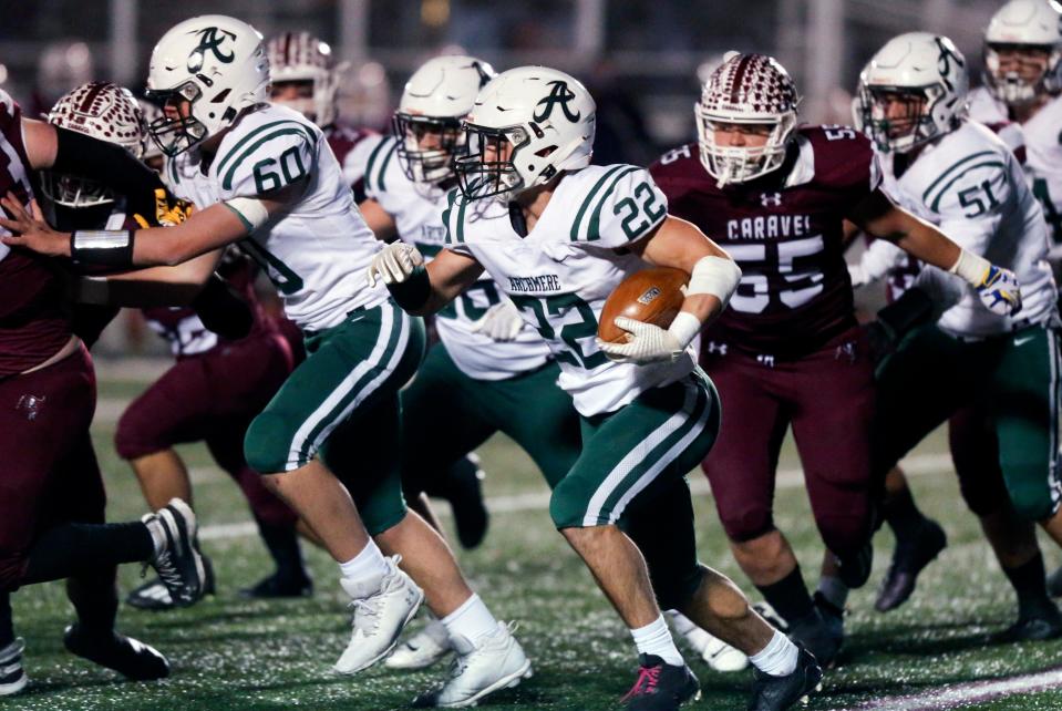 Archmere's Cole Fenice runs the ball in the third quarter of  Caravel's 30-6 win in the semifinals of the DIAA Class 2A state tournament Friday, Dec. 2, 2022 at Bob Peoples Stadium, 