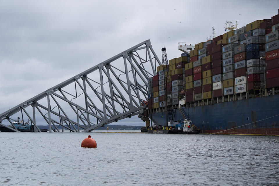 The Dali, a massive container ship from Singapore, still sits amid the wreckage and collapse of the Francis Scott Key Bridge in the Baltimore port, Monday, April 1, 2024. (Kaitlin Newman/The Baltimore Banner via AP)