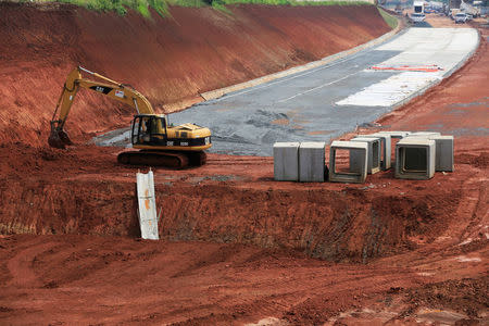 A heavy equipment as seen at the new Depok-Serpong highway road outskirt of Jakarta, Indonesia, April 18, 2018. Picture taken April 18, 2018. REUTERS/Beawiharta