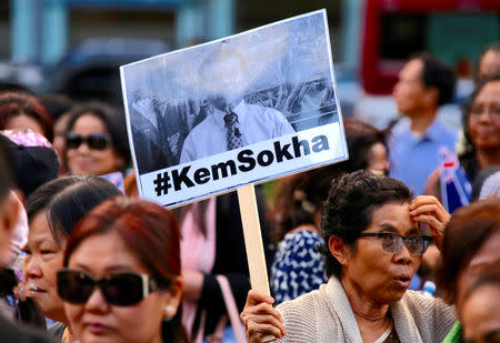 A protester holds a placard during a demonstration against Cambodia's Prime Minister Hun Sen, who is attending the one-off summit of 10-member Association of Southeast Asian Nations (ASEAN), in Sydney, Australia March 16, 2018. REUTERS/David Gray
