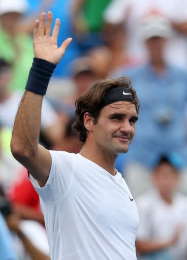 Roger Federer waves to the crowd after defeating Bernard Tomic during day six of the Western & Southern Open at Lindner Family Tennis Center, on August 16, in Mason, Ohio. Federer won 6-2, 6-4