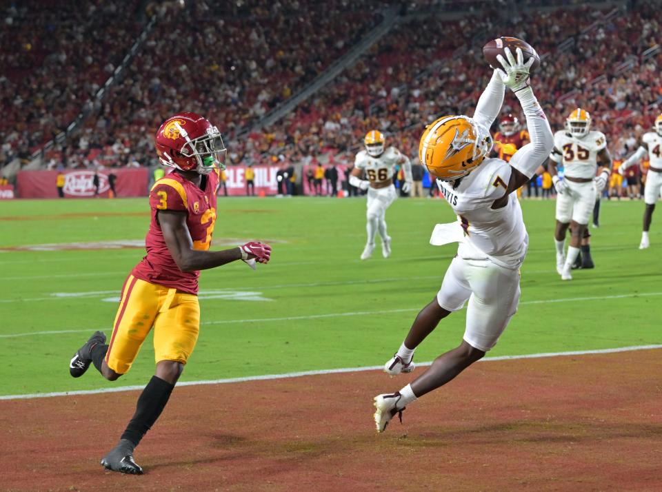 Oct 1, 2022; Los Angeles, California, USA; Arizona State Sun Devils defensive back Timarcus Davis (7) intercepts a pass in the end zone intended for USC Trojans wide receiver Jordan Addison (3) in the second half at United Airlines Field at the Los Angeles Memorial Coliseum. Mandatory Credit: Jayne Kamin-Oncea-USA TODAY Sports