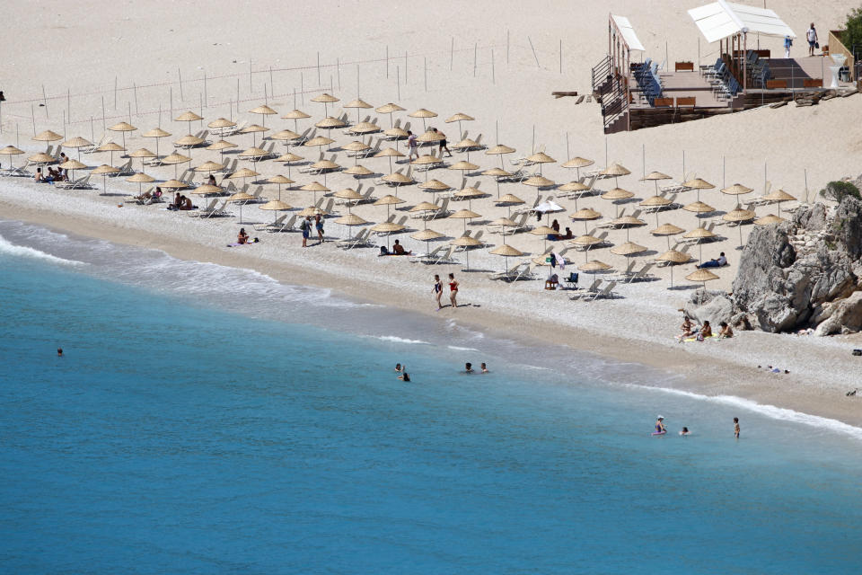 People are seen on Oludeniz Beach complying with social distance rules as a precaution against COVID-19 during the summer season in Fethiye district of Mugla, Turkey on June 15, 2020. (Photo by Ali RÄ±za Akkir/Anadolu Agency via Getty Images)