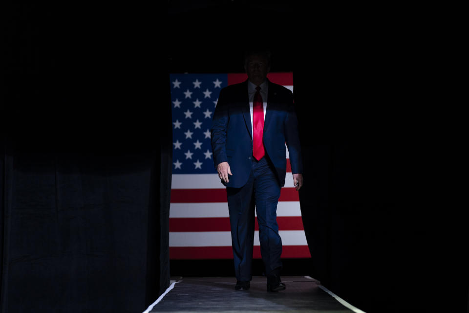 FILE - In this June 20, 2020, file photo President Donald Trump arrives on stage to speak at a campaign rally at the BOK Center in Tulsa, Okla. Trump is privately reassuring Republicans anxious about his deficits to Democrat Joe Biden, noting there are three months until Election Day and reminding them of the late-breaking events that propelled his 2016 comeback. (AP Photo/Evan Vucci, File)