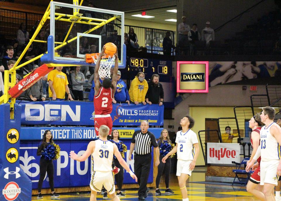 Denver's KJ Hunt throws down a dunk in the first half of Saturday's Summit League game against South Dakota State at Frost Arena.