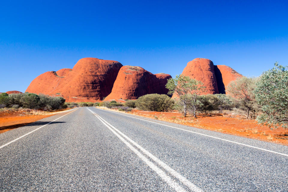 These ancient red rock formations glow and change colour corresponding to the surrounding desert landscape. [Photo: Getty]