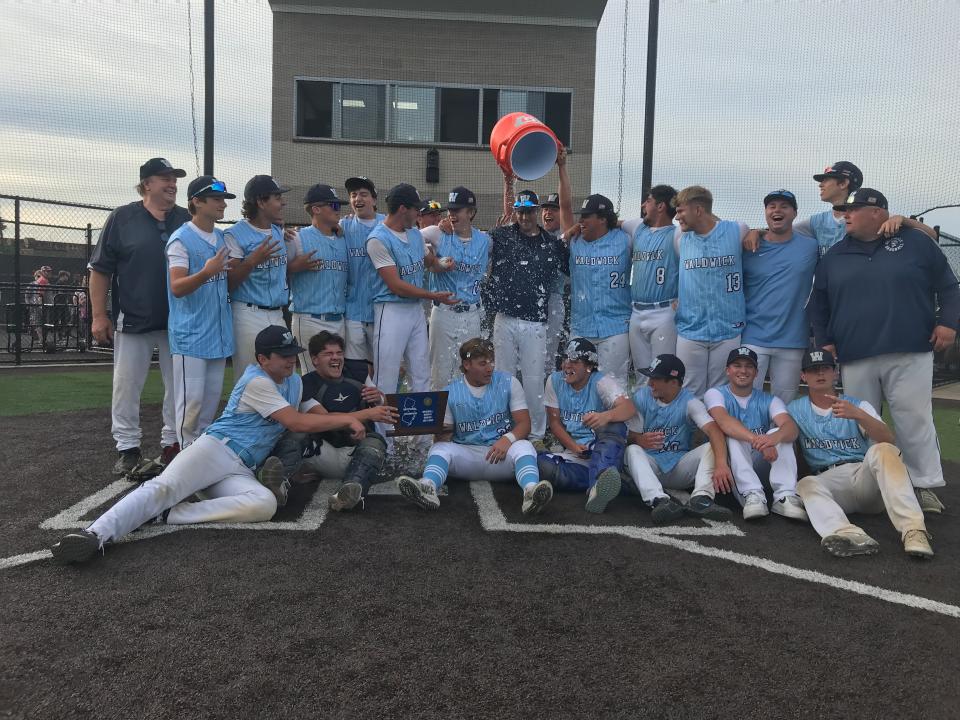 Waldwick baseball coach Dan Freeman gets doused with the water bucket as the team poses for a picture after winning the North 1, Group 1 championship. Friday, June 10, 2022 at Wood-Ridge Athletic Complex.