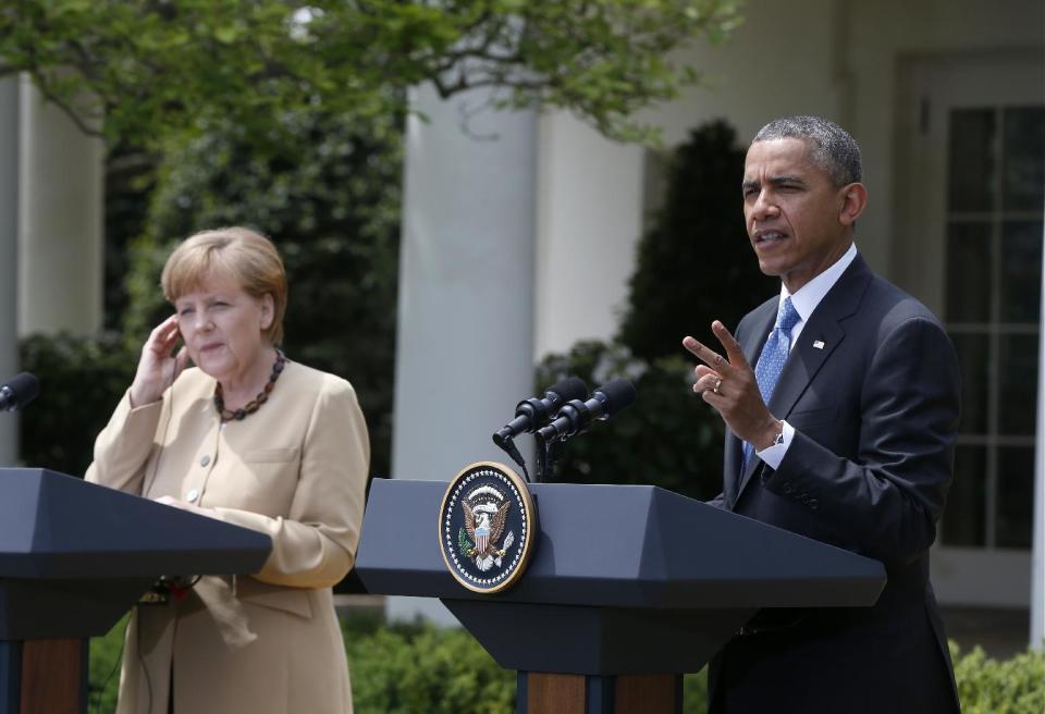President Barack Obama and German Chancellor Angela Merkel participate in a joint news conference in the Rose Garden of the White House in Washington, Friday, May 2, 2014. Obama and Merkel are putting on a display of trans-Atlantic unity against an assertive Russia, even as sanctions imposed by Western allies seem to be doing little to change Russian President Vladimir Putin's reasoning on Ukraine. (AP Photo/Charles Dharapak)