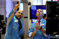 Specialists Meric Greenbaum, left, and Jay Woods work on the floor of the New York Stock Exchange, Friday, Feb. 28, 2020. Stocks are opening sharply lower on Wall Street, putting the market on track for its worst week since October 2008 during the global financial crisis. (AP Photo/Richard Drew)