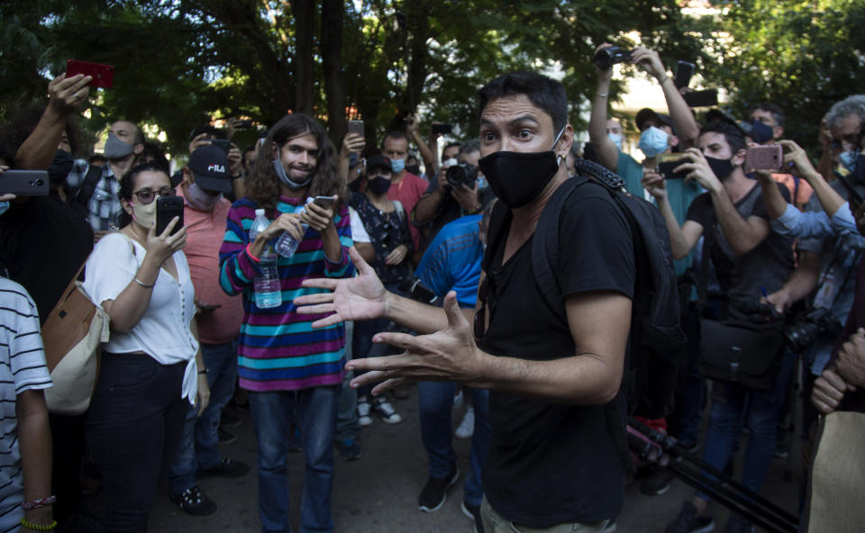 Young artists protest in front of the doors of the Ministry of Culture, in Havana, Cuba, Friday, Nov. 27, 2020. Dozens of Cuban artists demonstrated against the police evicting a group who participated in a hunger strike. (AP Photo/Ismael Francisco)