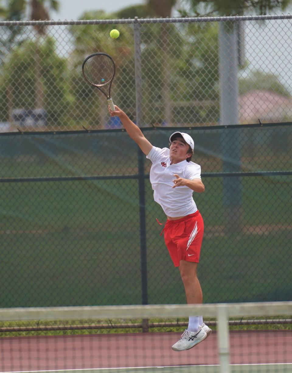 Vero Beach's Mac Johnson hits a return during the District 10-4A Tennis Championships held at Whispering Pines Park on Tuesday, April 11, 2023 in Port St. Lucie.