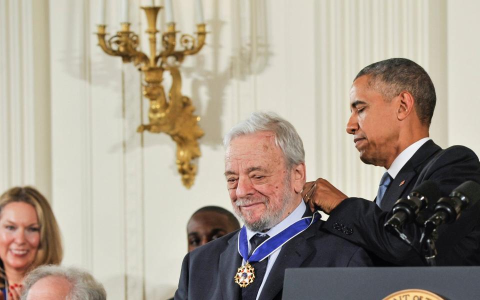 Receiving the Presidential Medal of Freedom from Barack Obama in 2015 - WireImage