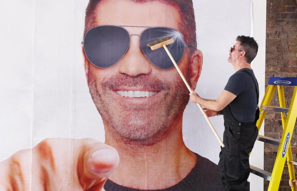 Simon Cowell puts up a billboard as part of his search for the UK’s next boyband (Joe Pepler/PinPep)