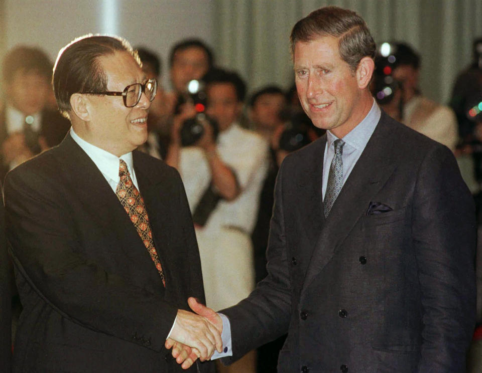 FILE - Then Chinese President Jiang Zemin, left, greets Britain's Prince Charles during a banquet and toast prior to handover ceremonies at the Hong Kong Convention Center, June 30, 1997. Chinese state TV said Wednesday, Nov. 30, 2022, that Jiang has died at age 96. (AP Photo/David Longstreath, Pool, File)