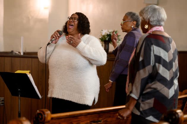Lisa Baldwin sings during a service at Holliday Memorial AME Zion Church. She's Annette's daughter and Demetrius' mother. (Photo: Justin Merriman for HuffPost)