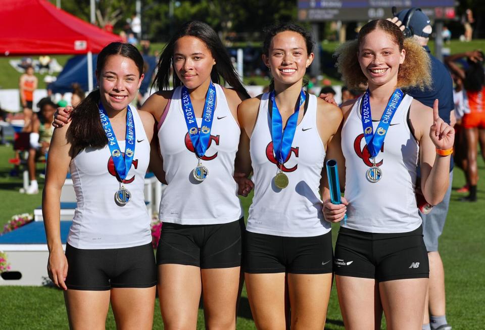 Oaks Christian celebrates its state title in the girls 4x100 meter relay.