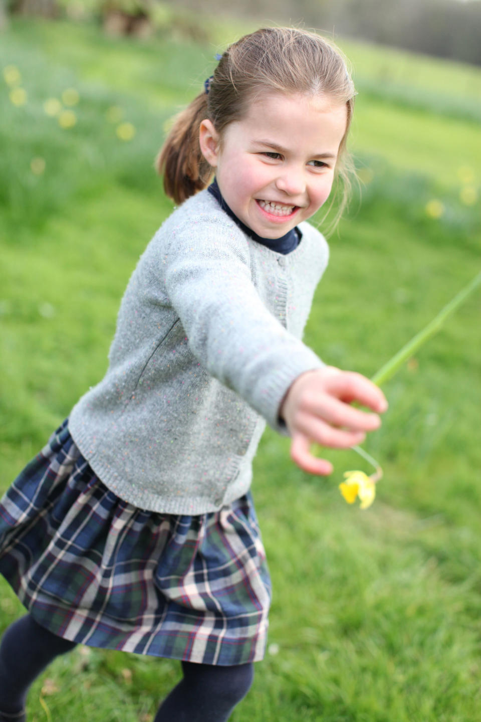 Princess Charlotte holds out a flower for mum Kate in Norfolk [Photo: The Duchess of Cambridge]